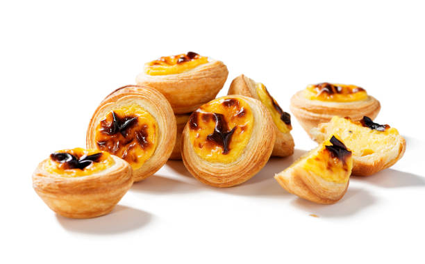 Traditional Portuguese egg tart dessert Pastel de nata. Traditional Portuguese egg tart dessert Pastel de nata. Isolated on white background pasteis de belem stock pictures, royalty-free photos & images