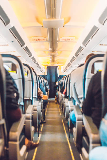 istock Narrow passage between rows of seats in the cabin 1342608890