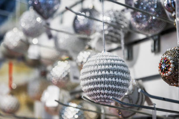 istock Christmas ball hangs on a shelf in the store 1342611143