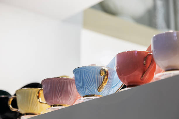 istock different-colored porcelain cups are on the counter 1342611192