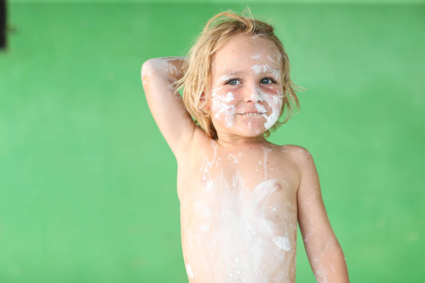 istock Painted boy looks like he will throw something 1342616122