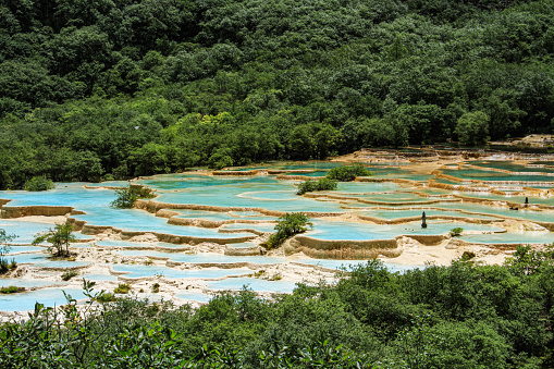 Ultramarine water in the travertine pools of the reserve