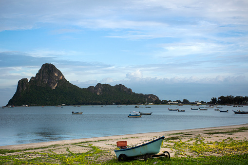 View landscape seascape and wooden fishing boat floating in sea waiting catch fish and marine life while night time in ocean of Prachuap bay beach at Gulf of Thailand in Prachuap Khiri Khan, Thailand