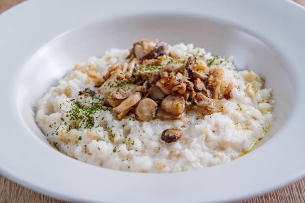 istock Mushroom risotto in a white bowl 1342621992