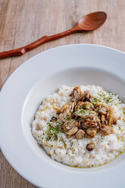 istock Mushroom risotto in a white bowl 1342621995