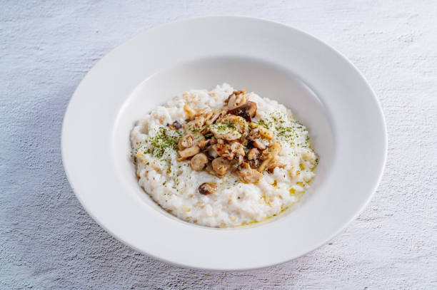 istock Mushroom risotto in a white bowl 1342622027