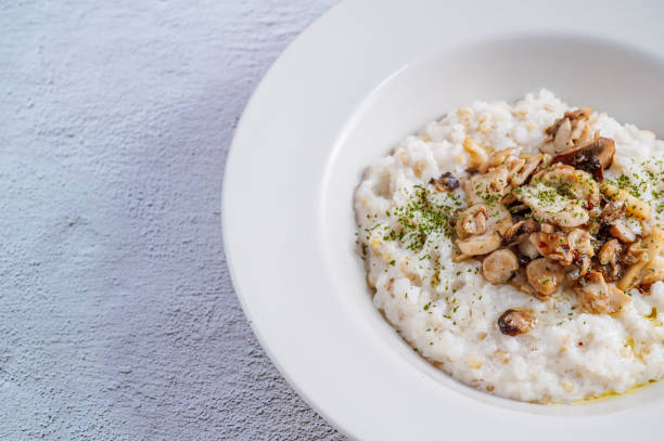 istock Mushroom risotto in a white bowl 1342622033