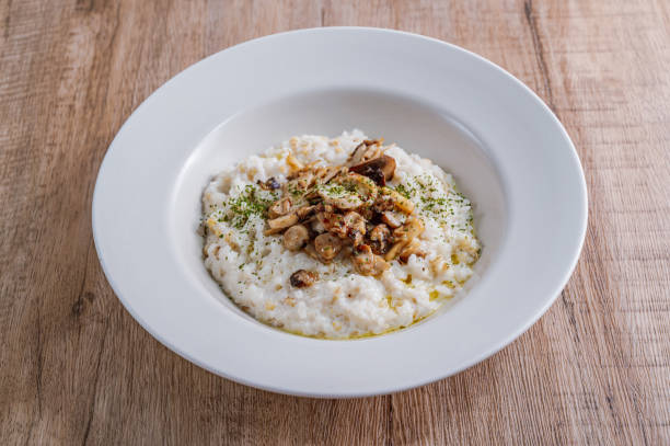 istock Mushroom risotto in a white bowl 1342622037