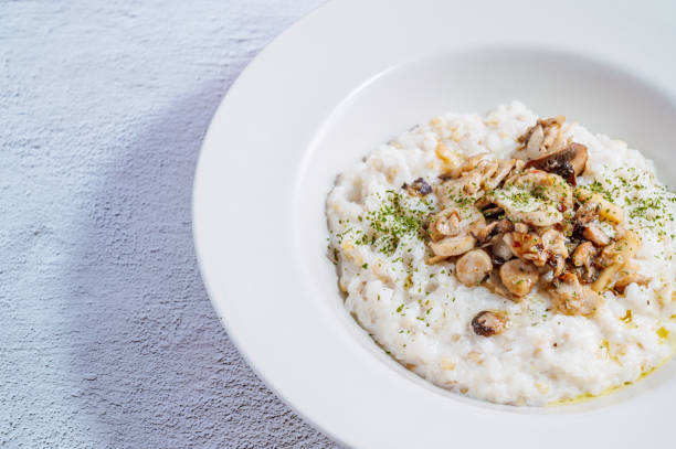 istock Mushroom risotto in a white bowl 1342622039