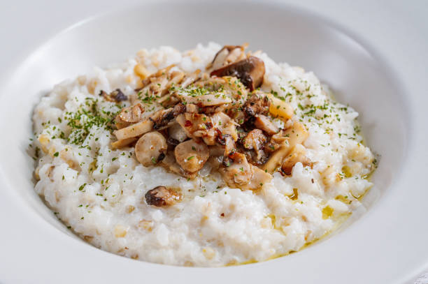 istock Mushroom risotto in a white bowl 1342622040