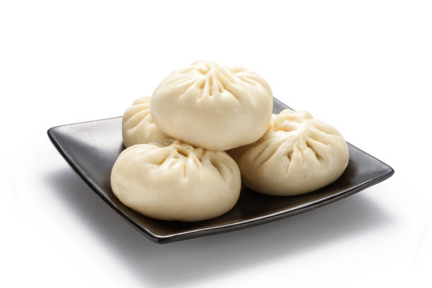 istock Fresh baozi (Chinese steamed buns) in a black ceramics plate 1342623208