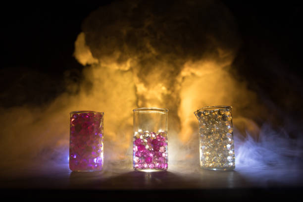 Pharmacy and chemistry theme. Test glass flask with solution in research laboratory. Science and medical background. Laboratory test tubes on abstract explosion cloud background. Selective focus