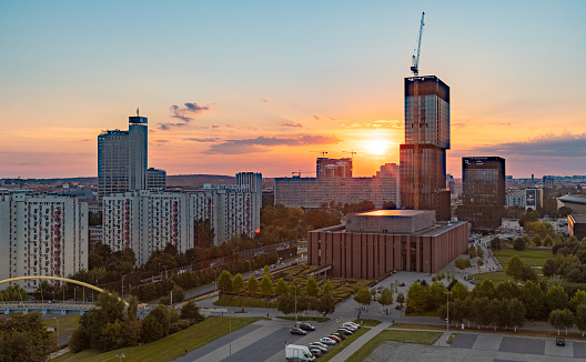 Katowice, Poland - September 11, 2021: A picture of some of Katowice's landmarks, such as the .KTW building complex and the National Polish Radio Symphony Orchestra, at sunset.