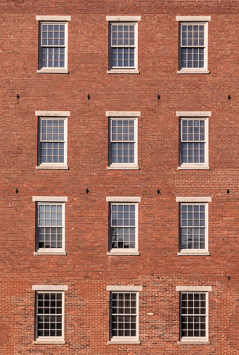 facade of old historic industry building made of brick, USA