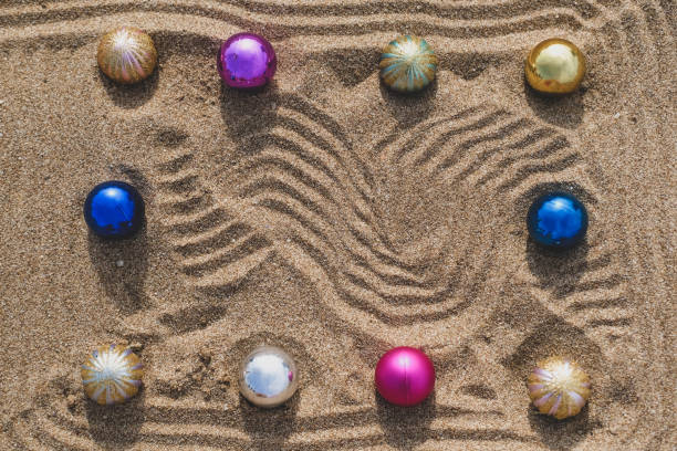 istock Christmas balls on the sand. 1342626170