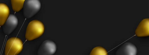istock Black and golden foil balloons with threads on black background. 1342626722