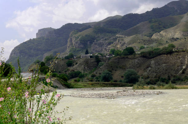 istock mountain village on a mountainside next to a river 1342627727