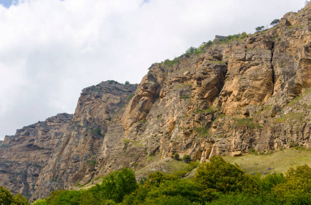 solid wall of impregnable stone mountains in the Caucasus stock photo