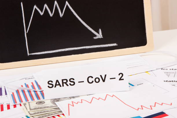 istock Currencies dollar with downward graphs representing financial crisis caused by coronavirus. Covid-19 1342630164