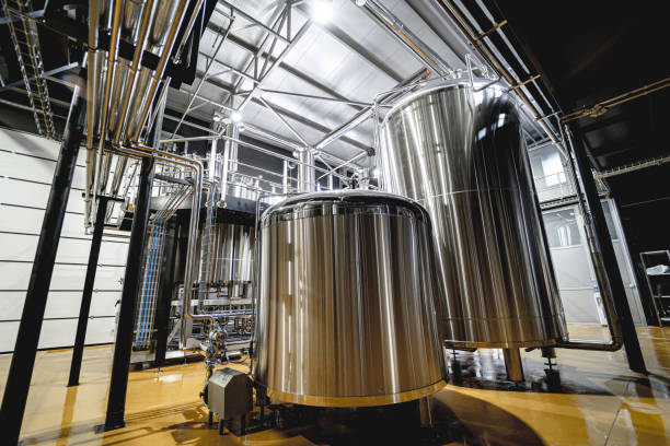 istock Craft beer brewing equipment in privat brewery 1342630415