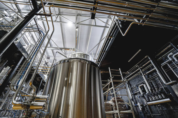 istock Craft beer brewing equipment in privat brewery 1342631012