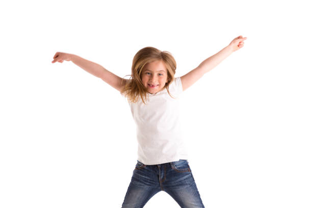 istock blond kid girl indented jumping high wind on hair 1342631486