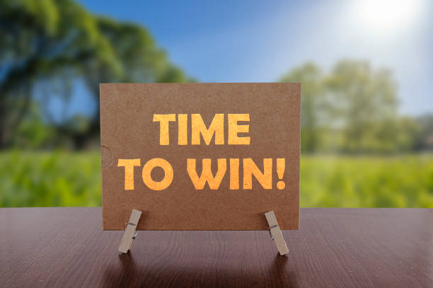 istock Time to win text on card on the table 1342634363