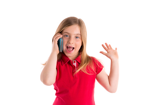 blond indented kid girl smiling talking smartphone phone on white background