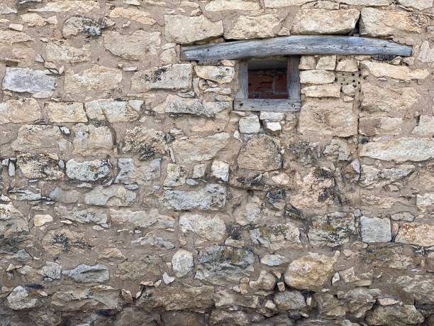 istock Old window on background in a village. 1342646044