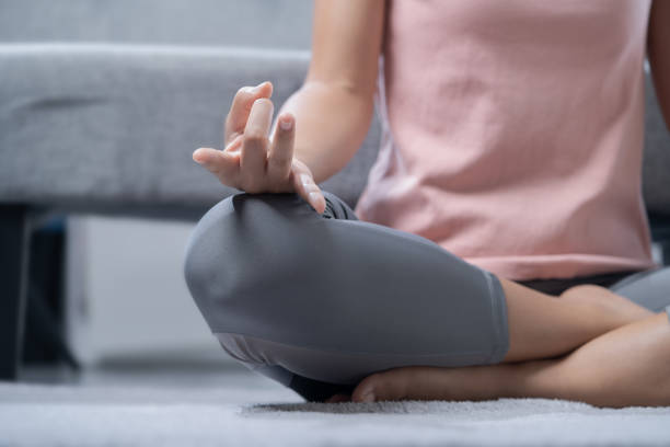 istock A young woman is doing yoga and meditating. 1342650828