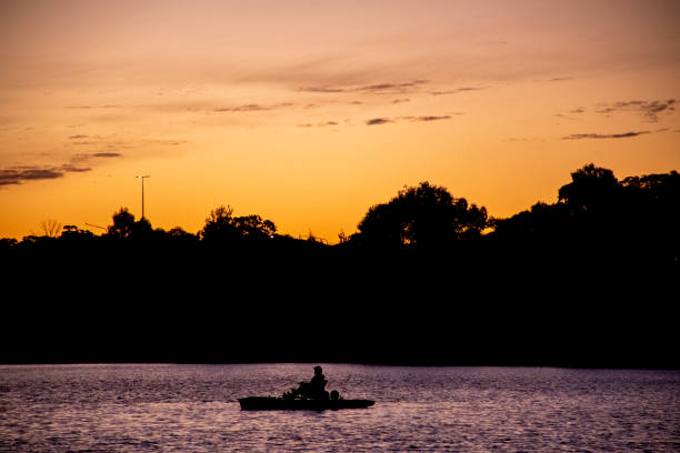 istock A Person Rowing a Boat at Sunset 1342665176