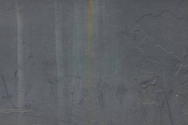 Part of a painted concrete wall.