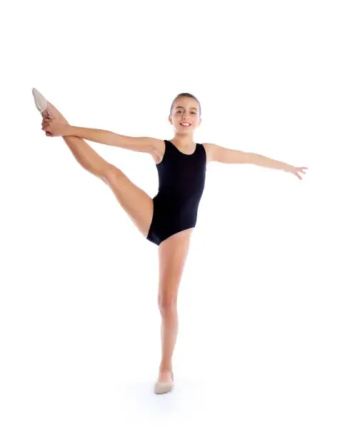 Kid girl rhythmic gymnastics exercises on white background