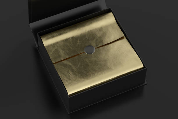 istock Black opened square folding gift box mock up with gold wrapping paper on black background. Side view. 1342692331