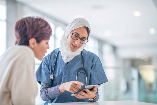 istock Muslim Surgeon Consults a Female Patient 1342708850