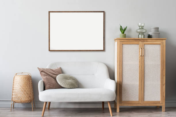 istock Artwork mock-up in interior design. Blank white picture frame on a grey wall 1342710682