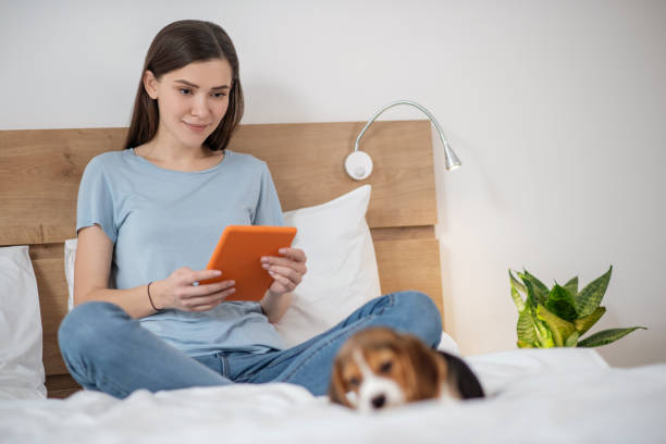istock A young woman spending time at home with her puppy 1342714910