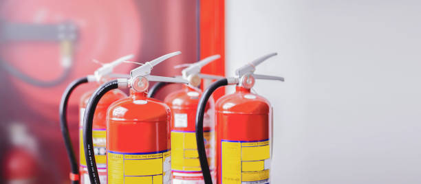 istock The red fire extinguisher is ready for use in case of an indoor fire emergency. 1342727038