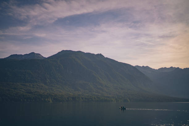 istock Friends paddle through tranquil alpine lake in canoe 1342727581