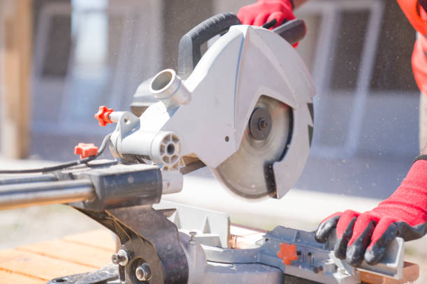 istock African american worker sawing plank during wood frame house construction 1342744937