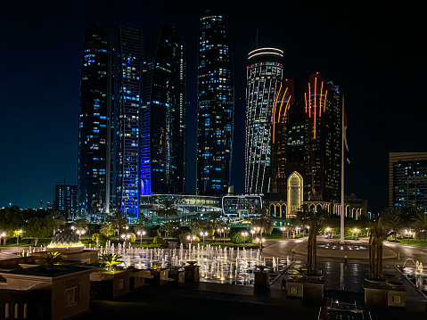 The Abu Dhabi skyline at night as taken from the Emirates Palace with the famous Etihad Towers to the left of the image. Sept 2021