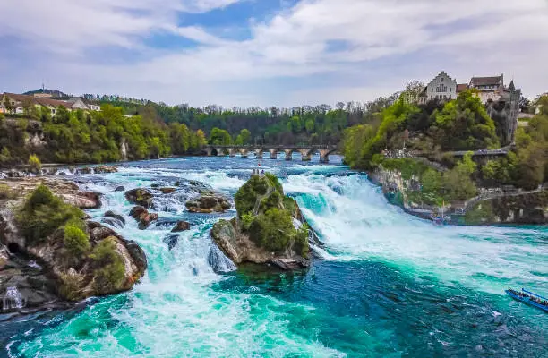 Rhine Falls Europes largest waterfall in plain in Neuhausen am Rheinfall Canton Schaffhausen Switzerland panorama view from above with drone.