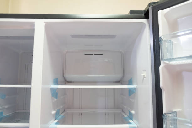 istock Inside of clean and empty refrigerator with shelves 1342796692