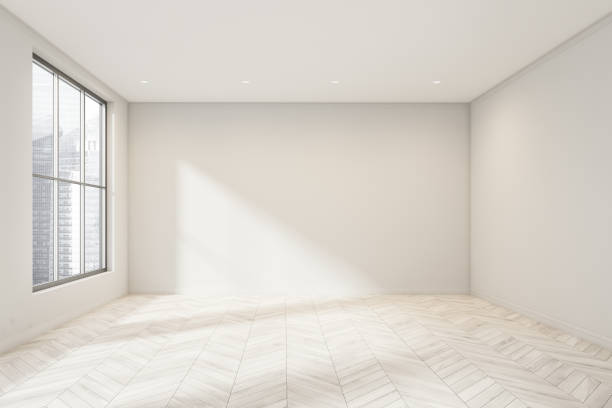 istock Empty white room space with wooden flooring 1342800955