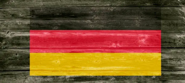 German flag on wooden background in vintage style