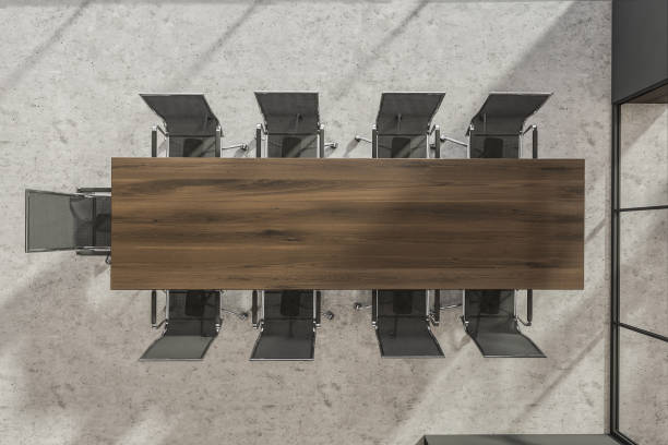 istock Conference room with dark wood tabletop, office chairs. Top view. 1342801896