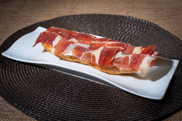 istock Toast with serrano ham and olive oil, side view. 1342804603