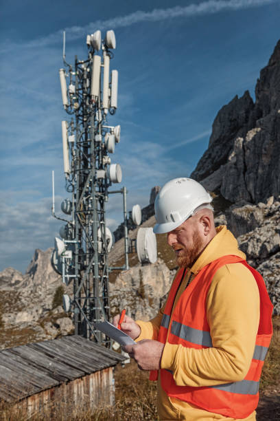 istock A male engineer utility worker at a telecom tower mountain site 1342806376
