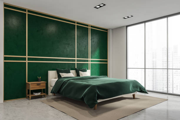 istock Bright malachite green wall in the panoramic bedroom. Corner view. 1342806568
