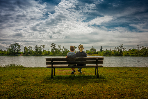 mother and her son resting on a bench